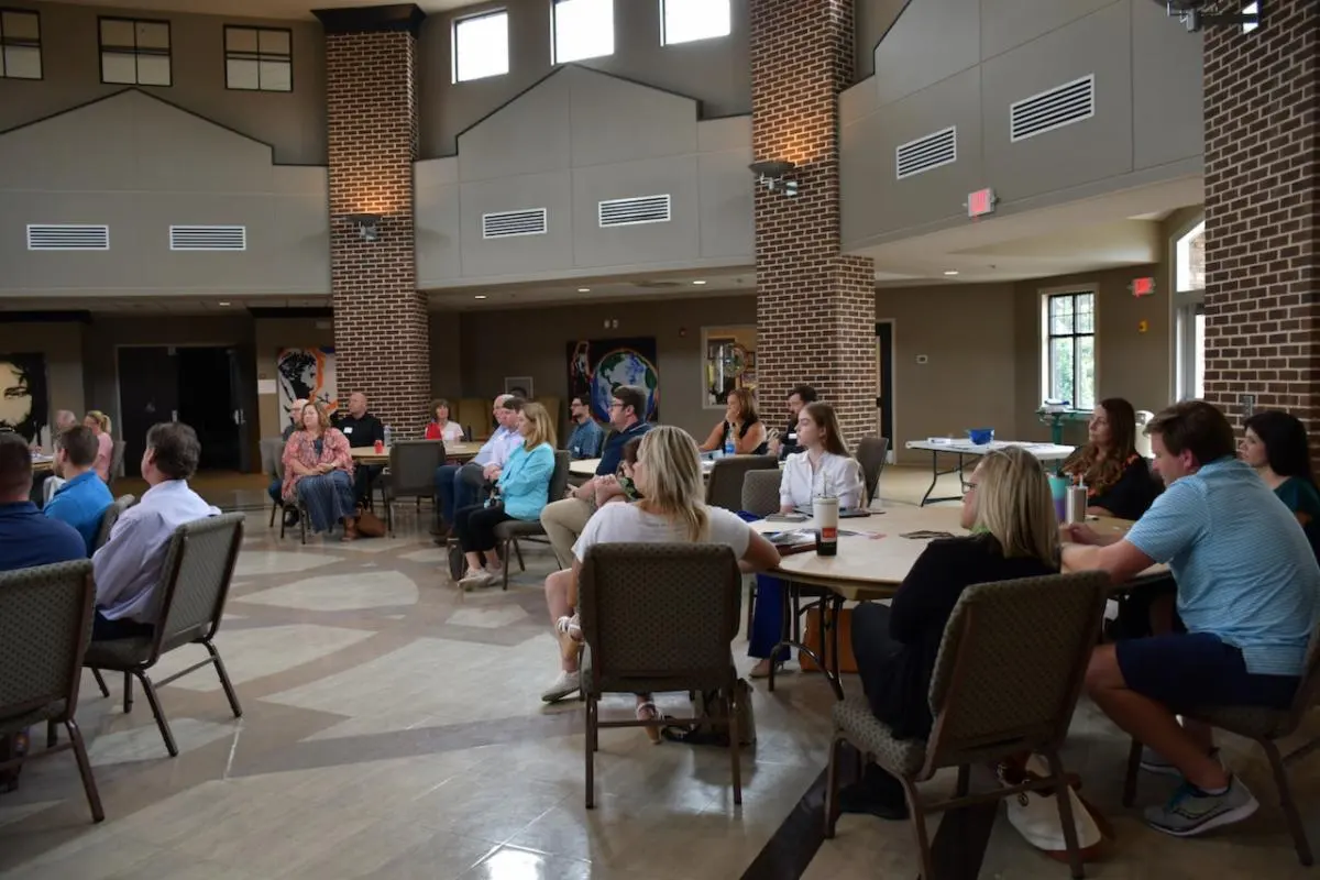 HVBCA members seated at round tables during a monthly lunch meeting at Hardin Valley Church of Christ